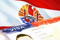 French Polynesia immigration document close up. Passport visa on French Polynesia flag. French Polynesia visitor visa in passport,