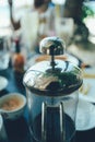 French press coffee maker in a cafe bar. close up image toned image selective focus Royalty Free Stock Photo