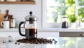 French press coffee maker with fresh coffee beans on countertop Royalty Free Stock Photo