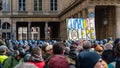 French protesters against the retirement reform with a sign 'Climate of anger' pass near the Constitutional Council