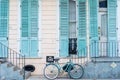 French Quarter Home in Pastel Blue with Bicycle and Dogs in Window Royalty Free Stock Photo