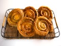 French raisin pastries on a wicker trail and white background