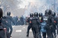 French riot police (Brav) facing rioters in the smoke of tear gas, Paris, France Royalty Free Stock Photo