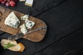 French roquefort cheese, on black wooden table, flat lay  with copy space for text Royalty Free Stock Photo