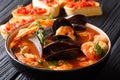 French seafood bouillabaisse soup closeup in a bowl served with