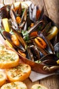 French seafood mussels with lemon, parsley and garlic close-up i
