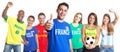 French soccer fan showing thumb up with other fans Royalty Free Stock Photo