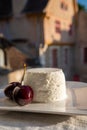 French soft white goat cheese served outdoor with fresh cherry Royalty Free Stock Photo
