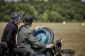 French soldier from first world war with an english gentelman on a old motorbike Royalty Free Stock Photo