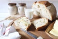 French sourdough bread, butter and glass of milk