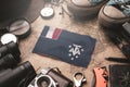 French Southern Flag Between Traveler`s Accessories on Old Vintage Map. Tourist Destination Concept