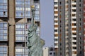 French Statue of Liberty Replica and modern buildings, Paris, France, AUGUST 1, 2015 - was given to Citizens of Paris in July 4, 1