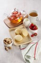 French strawberry pistachio macaron with berries tea. Afternoon tea still life