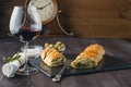 French stuffed bread with olives and glass of red wine on table