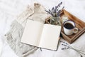 French summer still life. Feminine lifestyle composition. Cup of coffee, lavender flowers bouquet, candle on wooden tray