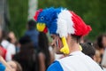 French supporter of football with with hat in shaped chicken