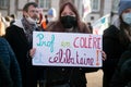 French teacher protesting with placard in french : prof en colere et celibataire, in english : angry teacher and single