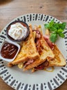 French toast with bacon fried bananas and syrup sides cream and salted caramel Royalty Free Stock Photo