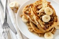 French toast with bananas, walnuts and maple syrup Royalty Free Stock Photo