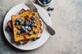 French toast with blueberries, pecan and maple syrup for breakfast on white plate Royalty Free Stock Photo