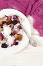 French toast casserole with berries and vanilla ice cream on white wooden background Royalty Free Stock Photo