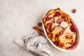 French toast casserole with raspberries, powdered sugar and cinnamon, copy space. Royalty Free Stock Photo