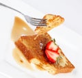 French toast with drip of syrup and strawberries Royalty Free Stock Photo