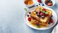 French toast with fresh berries and honey for breakfast