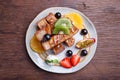 French toast and fresh fruit with caramel sauce Royalty Free Stock Photo