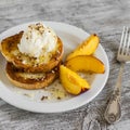 French toast with ice cream and honey on a white plate Royalty Free Stock Photo