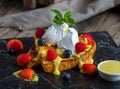 french toast with strawberry, blackberry, cream and basil served in a dish isolated on cutting board side view of breakfast on Royalty Free Stock Photo