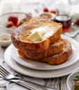 French toast, warm French toast made of sliced brioche with fresh butter, sprinkled with powdered sugar.