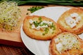 French toasts with goats cheese, fresh chives and sprouts.