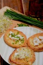 French toasts with goats cheese, fresh chives and sprouts.