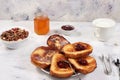 French toasts and granola on a gray table with breadcrumbs. Fried bread with milk and scrambled eggs. Top view, place for text. Royalty Free Stock Photo