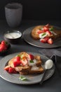 French toasts with yogurt and strawberries for breakfast Royalty Free Stock Photo