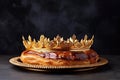 It is a French tradition to serve galette de roi for dinner. On a dark background.