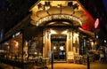 The French traditional cafe Au cepage Montmartrois at night, Paris, France. Royalty Free Stock Photo