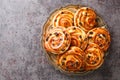 French traditional pastries Pains aux raisins closeup in the plate. Horizontal top view