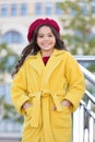 French trend fall season. Girl walk defocused background. Charming little french style fashionable girl. Hat accessory