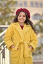 French trend fall season. Girl walk defocused background. Charming little french style fashionable girl. Hat accessory