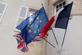 French uk English brexit and EU European Union flag waving in building facade Royalty Free Stock Photo