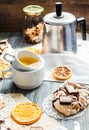 French vanilla meringue with chocolate and caramel, orange tea Royalty Free Stock Photo