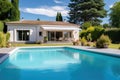 french villa with hipped roof and swimming pool view Royalty Free Stock Photo