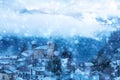 French village in snow, old church cloud covered Royalty Free Stock Photo