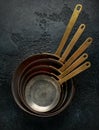 French Vintage Copper saute pans, kitchen utensil on dark background Royalty Free Stock Photo