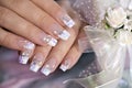 French wedding manicure with translucent glitters, white dots