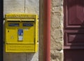 French yellow metal mailboxes.