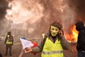 French Yellow Vest Protestor wearing Guy Fawkes mask at a Demonstration in Paris Royalty Free Stock Photo