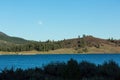 Frenchman lake at sunset land and water with full moon in the sky